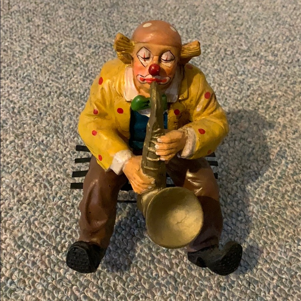 Clown playing saxophone statue